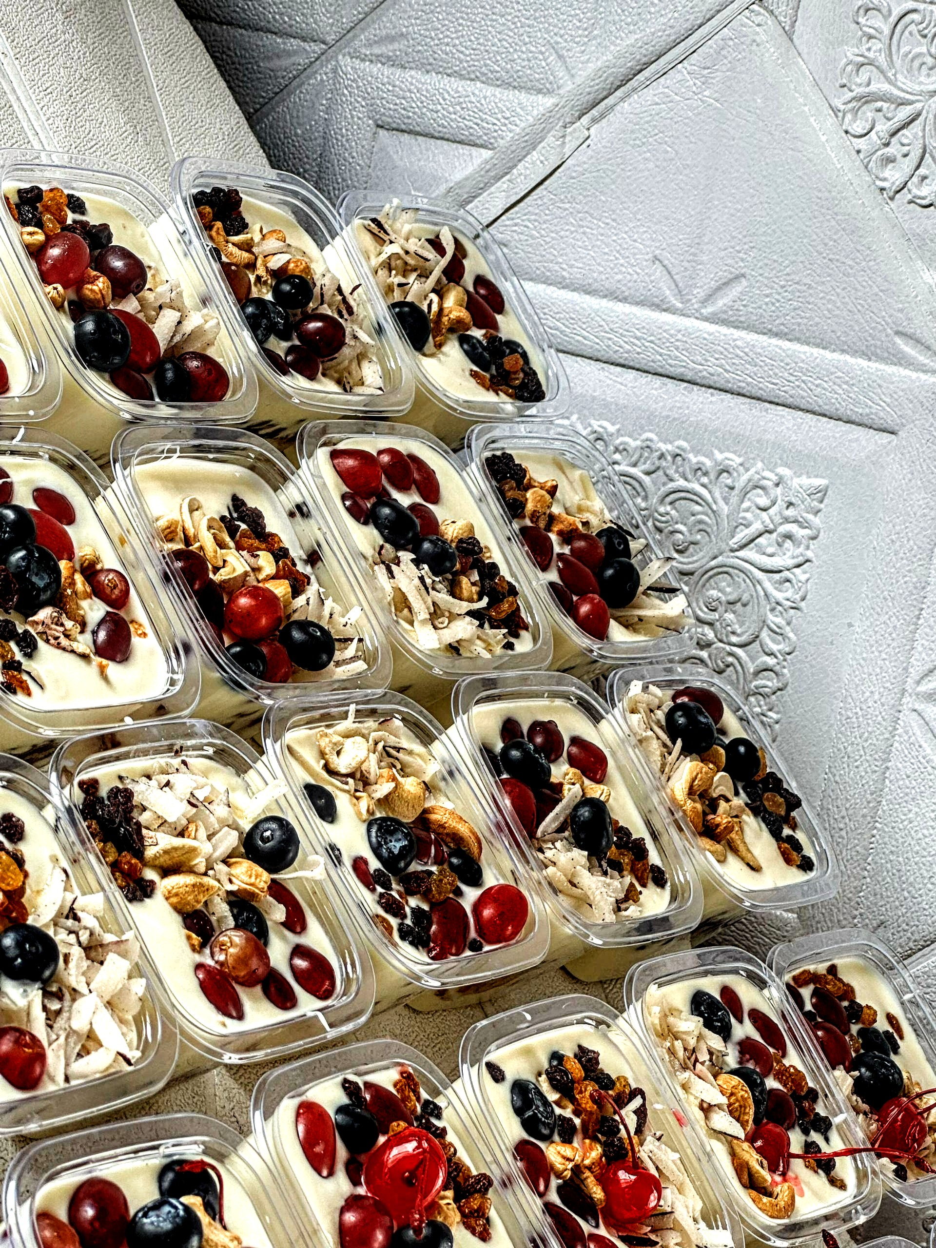 Individual servings of creamy dessert with toppings.